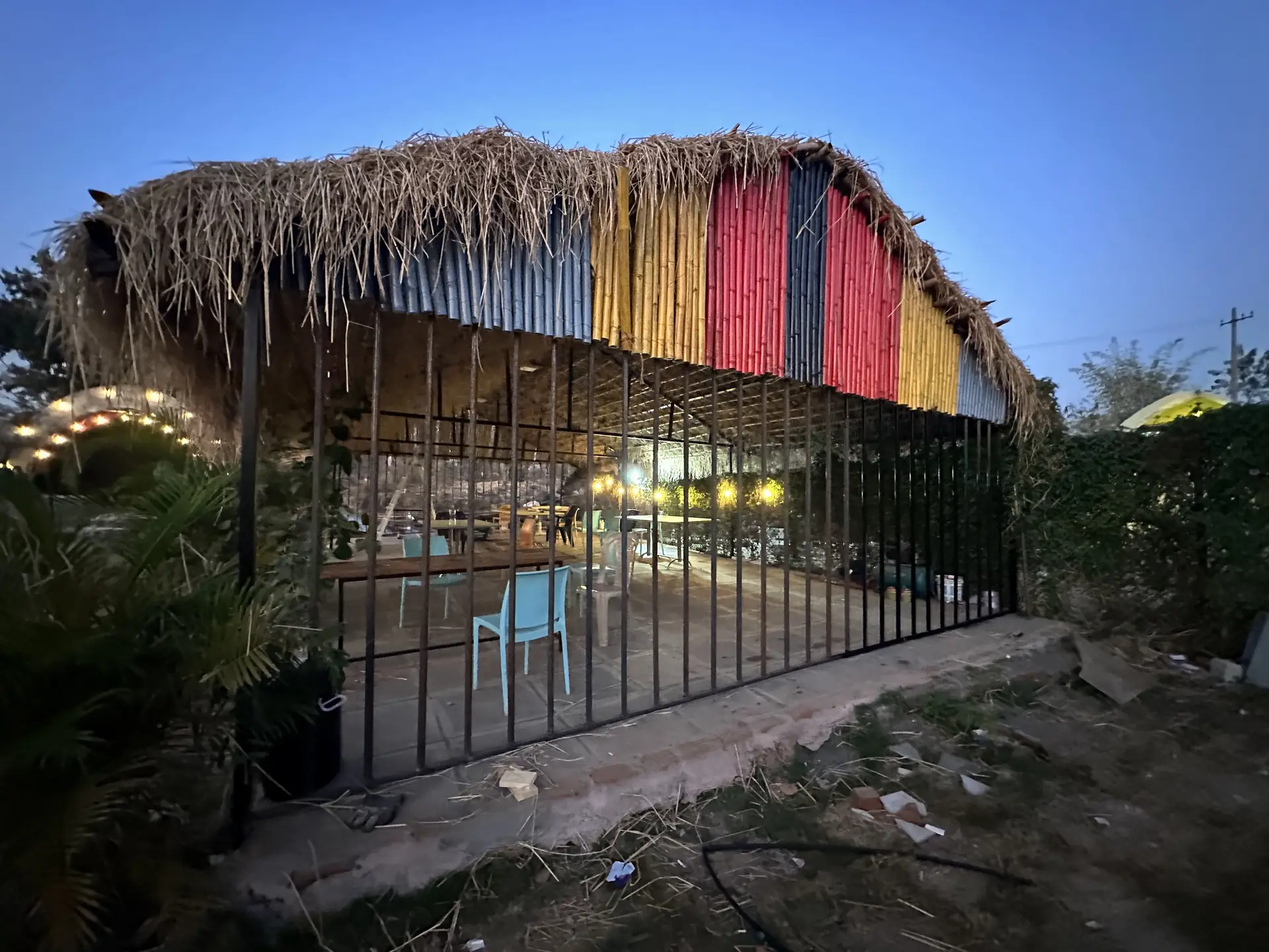 Thatched-roof open dining pavilion at camp