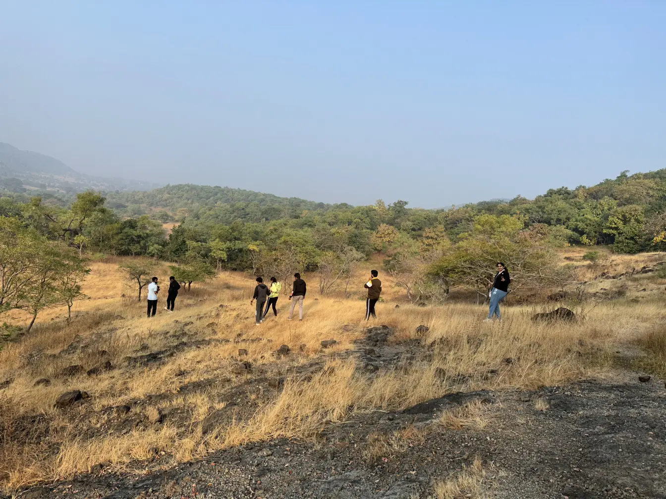 Group walking through the golden Ananthagiri hills
